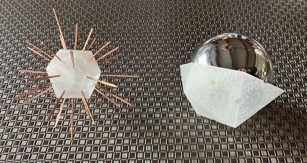 3D printed icosahedrons, one with copper rods at edge centers, one used as a marking jig with a shiny stainless steel sphere inside